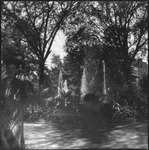 Woman posing in front of fountain