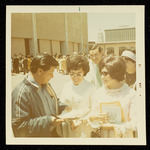 Cesar Chavez standing with Mary F. Lopez