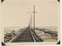 Man walking along completed temporary trestle