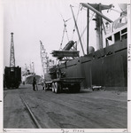 Ship loading freight from truck