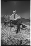 Mr. Rogers sitting on set while filming promotion on KUHT