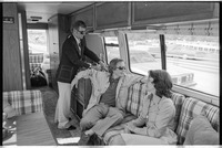 Dick Cavett looks out window of RV