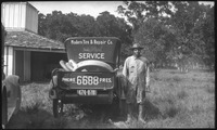 Men next to car with tires