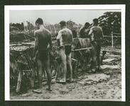 POWs at urinal at POW camp