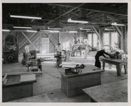 Men in a workshop using power tools