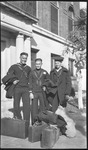 Sailors  stand with luggage in front of them
