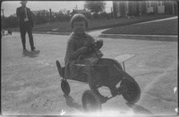 Girl on pedal airplane toy