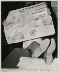 Reporter reading the first edition of the Houston Post