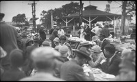 Group of people with wooden tables and food