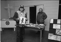 Man holding sign at the Ku Klux Klan Information Center