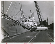 Crane loading materials onto ship