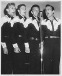 Singing quartet at microphone