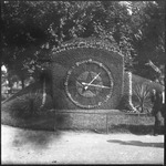 Clock carved out of a hedge
