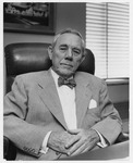 Hugh Roy Cullen in an office chair
