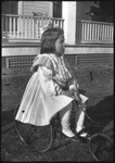 Girl on tricycle