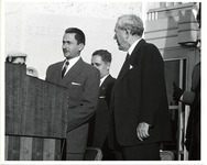 Hugh Roy Cullen standing next to a man at a podium