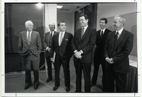 Roy H. Cullen standing with a group of men