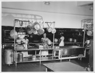 Women preparing a meal in a chef's kitchen
