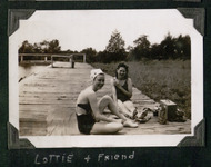 Lottie and friend sitting on dock