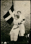 Leonor Villegas de Magnón and Aracelito Garcia with flag of La Cruz Blanca 
