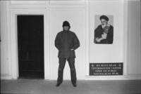 Man standing in front of Ku Klux Klan Information Center