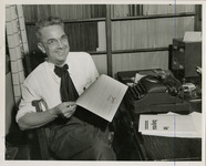 French department professor posing with a letter