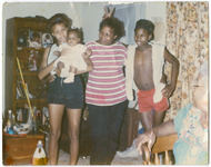 DJ Screw with his mother, Ida Mae Deary Davis, his grandmother Jessie Deary, his sister, Michelle Wheeler, and his niece Shimeka, June 1986