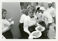 Restaurant management students expediting dinner service