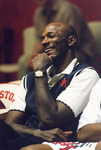 Clyde Drexler laughing during a basketball game