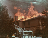 Firefighters fighting building fire