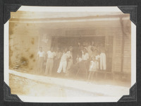 People gathered outside of a shop