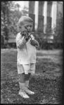 Young boy playing a small violin