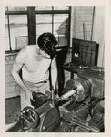 Man working with a lathe