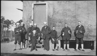Group of sailors in front of a building