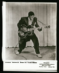 Clarence "Gatemouth" Brown posing with his guitar
