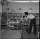 KUHT crew films students in library