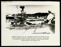 USS Houston (CA-30) at Tjilatjap, Java, with colors at half-mast pending return of her funeral party