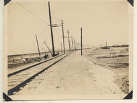 Crew works beside the reconstructed track at Oyster
