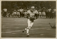 UH football player, Donnie McGraw, running with the ball