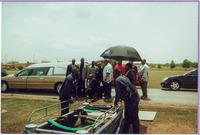 Pallbearers for Fat Pat gathered around hearse at cemetery