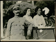Uniformed man and two women