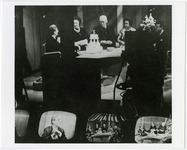 KUHT anchors gather around a cake