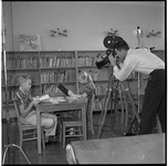KUHT crew films students in library
