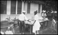 Group of people at table with food
