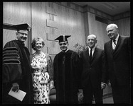 President Philip G. Hoffman with Jack Valenti and three regents at a commencement ceremony
