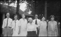 Group of people in front of house