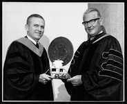 President Philip G. Hoffman with commencement speaker astronaut Frank Borman at a commencement ceremony