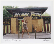 Choice posing in front of abandoned building