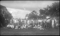 Large group of people gathered on grass