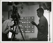 Ernest Brock prepares KUHT set for filming